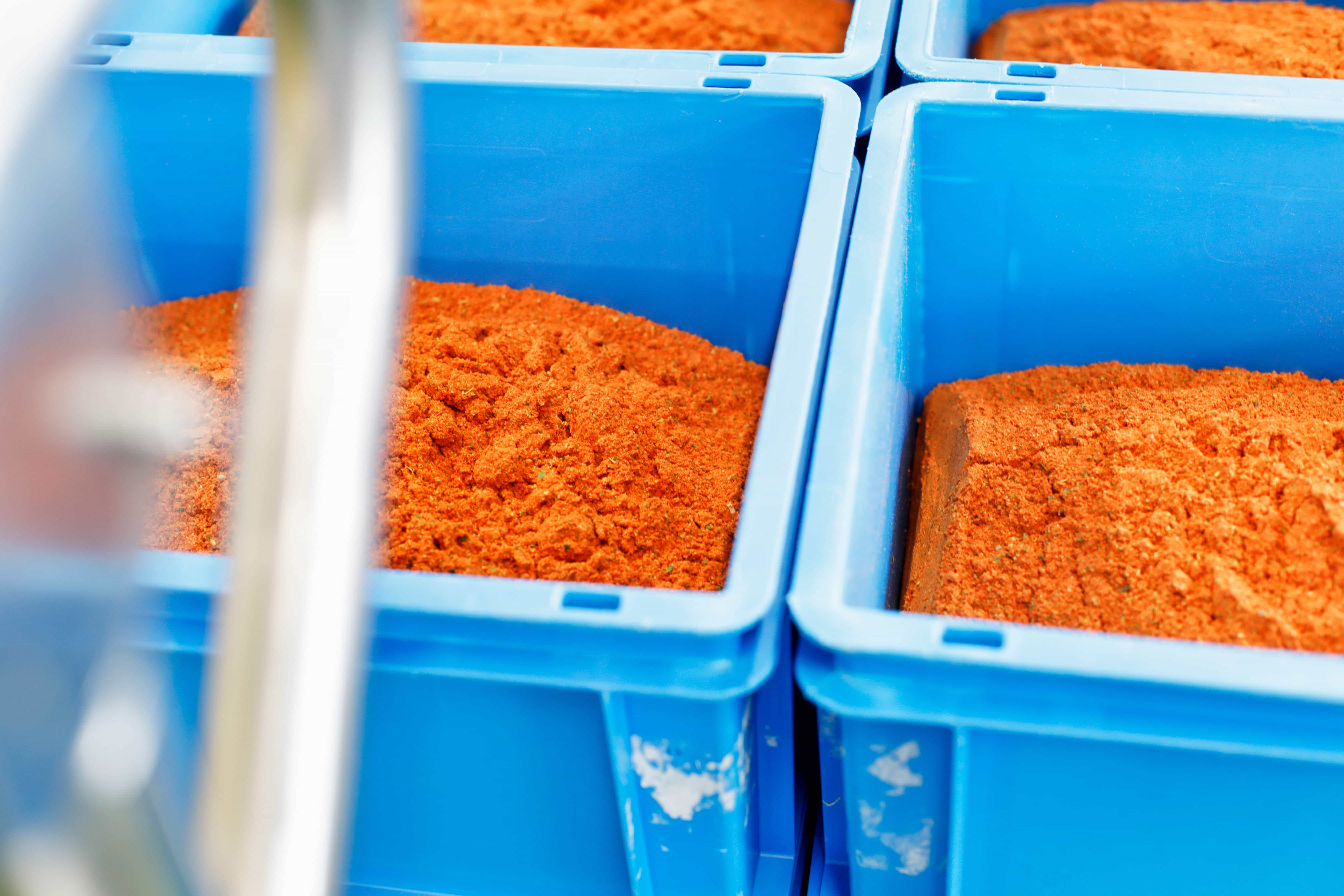 Orange spices in blue boxes